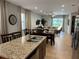 Kitchen with granite countertops, stainless steel appliances, and an island at 370 Lasso Dr, Kissimmee, FL 34747