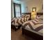 Bedroom with two beds and chevron bedding at 370 Lasso Dr, Kissimmee, FL 34747