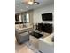Living room with sofas, coffee table, and TV at 370 Lasso Dr, Kissimmee, FL 34747