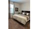 King-size bed in a well-lit bedroom with large window at 370 Lasso Dr, Kissimmee, FL 34747