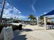 Resort-style pool with water features, lounge chairs, and a shaded seating area at 370 Lasso Dr, Kissimmee, FL 34747