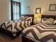 Bedroom with two beds and chevron bedding at 370 Lasso Dr, Kissimmee, FL 34747