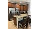 Kitchen island with granite countertop and stainless steel appliances at 370 Lasso Dr, Kissimmee, FL 34747