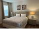 King-size bed in a well-lit bedroom with window coverings at 370 Lasso Dr, Kissimmee, FL 34747