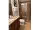 Bathroom with granite vanity, shower, and toilet at 370 Lasso Dr, Kissimmee, FL 34747