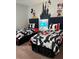 Bedroom with twin beds, nightstand, and Disney decor at 370 Lasso Dr, Kissimmee, FL 34747
