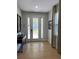 Bright entryway with tile floors, a console table, and a decorative mirror at 370 Lasso Dr, Kissimmee, FL 34747