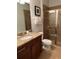Bathroom with granite vanity, shower, and toilet at 370 Lasso Dr, Kissimmee, FL 34747