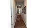 Long hallway with carpeted floor and mirrors at 370 Lasso Dr, Kissimmee, FL 34747