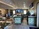 Restaurant bar with seating and multiple large screen TVs at 370 Lasso Dr, Kissimmee, FL 34747