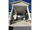 Resort building exterior with a porte cochere and seating at 370 Lasso Dr, Kissimmee, FL 34747