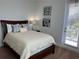 Bedroom with a queen bed and private access to a patio at 370 Lasso Dr, Kissimmee, FL 34747