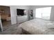 Main bedroom with large bed, dresser, and TV at 1165 Trappers Trail Loop, Davenport, FL 33896