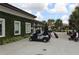 Golf clubhouse with lush landscaping and golf carts at 1165 Trappers Trail Loop, Davenport, FL 33896