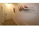 Bright entryway with wood-look floors and nautical wall art at 1165 Trappers Trail Loop, Davenport, FL 33896