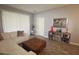 Spacious living room with sectional sofa and large window at 1165 Trappers Trail Loop, Davenport, FL 33896