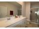 Double vanity bathroom with a large mirror and separate shower at 1165 Trappers Trail Loop, Davenport, FL 33896