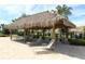 Relaxing shaded seating area with lounge chairs near the pool at 1165 Trappers Trail Loop, Davenport, FL 33896