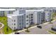 Modern apartment building with ample parking and landscaping at 3180 Paradox Circle # 203, Kissimmee, FL 34746