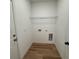 Laundry room with vinyl flooring and a utility shelf at 14759 Sw 43Rd Terrace Rd, Ocala, FL 34473