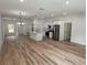 Modern kitchen with island, stainless steel appliances, and white cabinets at 14759 Sw 43Rd Terrace Rd, Ocala, FL 34473