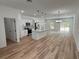 Modern kitchen with island, stainless steel appliances, and white cabinets at 14759 Sw 43Rd Terrace Rd, Ocala, FL 34473