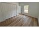 Bedroom with wood-look floors and a large closet at 14759 Sw 43Rd Terrace Rd, Ocala, FL 34473