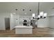 Modern kitchen with island, stainless steel appliances, and white cabinets at 14759 Sw 43Rd Terrace Rd, Ocala, FL 34473
