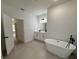 Bathroom boasts a freestanding tub, double vanity, and separate shower at 14759 Sw 43Rd Terrace Rd, Ocala, FL 34473