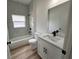 Updated bathroom with tub, toilet and vanity at 14759 Sw 43Rd Terrace Rd, Ocala, FL 34473
