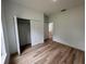 Bright bedroom with wood-look floors and a spacious closet at 14759 Sw 43Rd Terrace Rd, Ocala, FL 34473