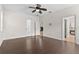 Spacious bedroom with dark hardwood floors and access to backyard at 5277 Mill Stream Dr, Saint Cloud, FL 34771