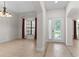 Formal dining room with tiled floors and large window at 5277 Mill Stream Dr, Saint Cloud, FL 34771