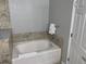 Relaxing bathtub with tile surround at 14501 Grove Resort Ave # 1105, Winter Garden, FL 34787
