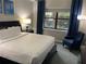 Bedroom with queen bed and window view at 14501 Grove Resort Ave # 1105, Winter Garden, FL 34787
