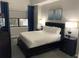 Spacious bedroom with queen-size bed and dark wood furniture at 14501 Grove Resort Ave # 1105, Winter Garden, FL 34787