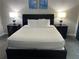 Spacious bedroom with a comfortable bed and nightstands at 14501 Grove Resort Ave # 1105, Winter Garden, FL 34787