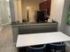 Breakfast bar with seating area and views into the kitchen at 14501 Grove Resort Ave # 1105, Winter Garden, FL 34787