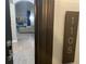 Modern entryway with updated door hardware and unit number plaque at 14501 Grove Resort Ave # 1105, Winter Garden, FL 34787