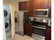 Kitchen boasts stainless steel appliances and ample cabinet space at 14501 Grove Resort Ave # 1105, Winter Garden, FL 34787