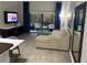 Bright living room with comfortable seating and access to a balcony at 14501 Grove Resort Ave # 1105, Winter Garden, FL 34787