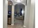 Open living room with view into kitchen and access to patio at 14501 Grove Resort Ave # 1105, Winter Garden, FL 34787