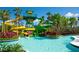 Community pool with water slides and lush landscaping at 14501 Grove Resort Ave # 1105, Winter Garden, FL 34787