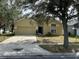 House exterior with driveway and landscaping at 4400 Creeks Run Blvd, Kissimmee, FL 34746