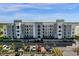 Modern building exterior with ample parking at 3191 Paradox Cir # 202, Kissimmee, FL 34746