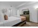 Bright bedroom with a comfy bed, dresser, and TV at 3191 Paradox Cir # 202, Kissimmee, FL 34746