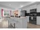 Open kitchen with island and stainless appliances at 3191 Paradox Cir # 202, Kissimmee, FL 34746
