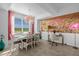 Bright dining room with a unique wall accent and seating for six at 3191 Paradox Cir # 202, Kissimmee, FL 34746