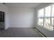 Bright bedroom with gray carpet and large windows at 2368 Zaballina Pl, Kissimmee, FL 34747