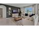 Living room showcases a sectional sofa, coffee table, and large TV at 3438 Sabatia Ln, Poinciana, FL 34759